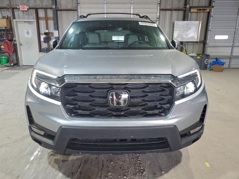 Photo 5 from auction – 2023 HONDA PASSPORT E with VIN 5FNYF8H5XPB038041