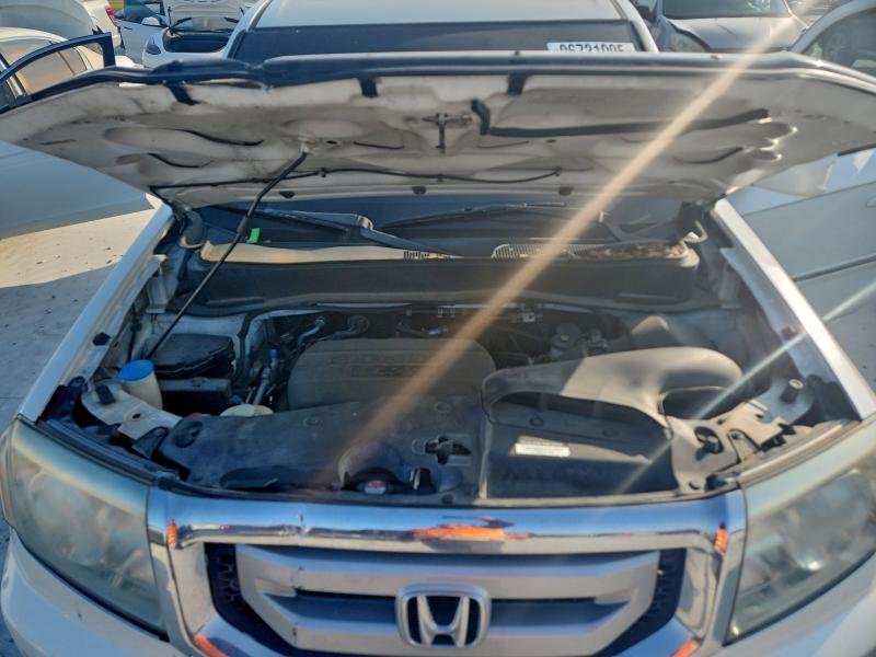 Photo 12 from auction – 2011 HONDA PILOT TOUR with VIN 5FNYF3H92BB041529