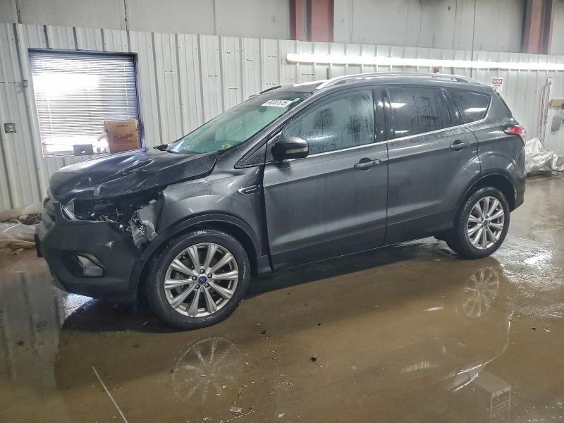 FORD ESCAPE TIT 2017 with VIN 1FMCU0J93HUE02898 - Photo from auction