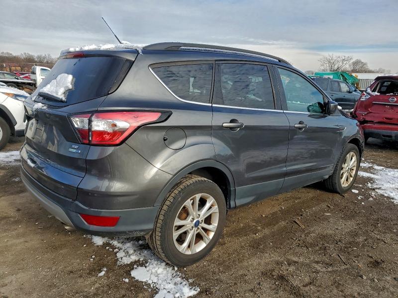 Photo 3 from auction – 2018 FORD ESCAPE with VIN 1FMCU9GD4JUC27860