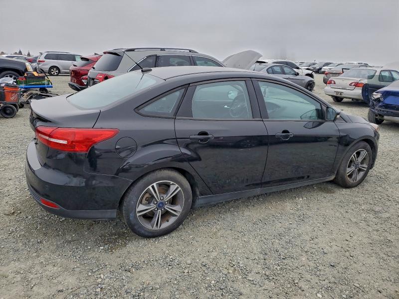 Photo 3 from auction – 2016 FORD FOCUS SE with VIN 1FADP3FEXGL311290