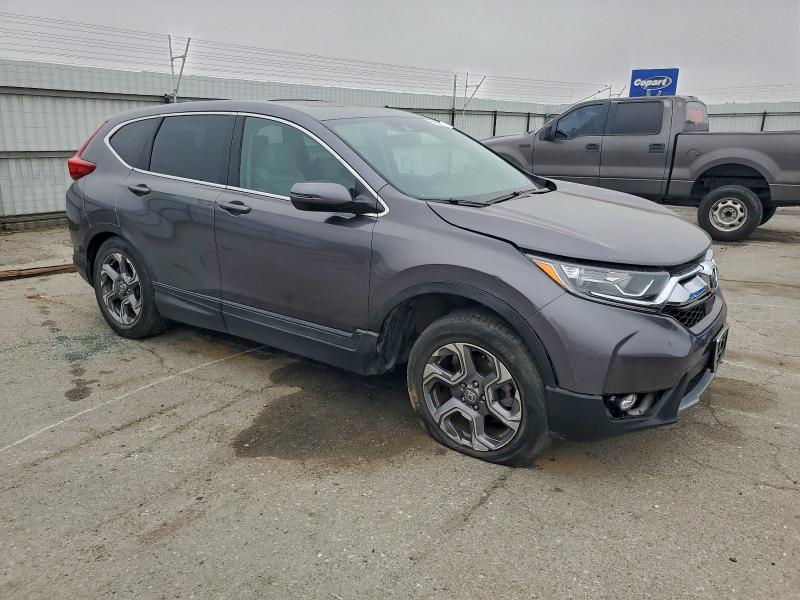 Photo 4 from auction – 2017 HONDA CR-V EXL with VIN 7FARW1H85HE021112