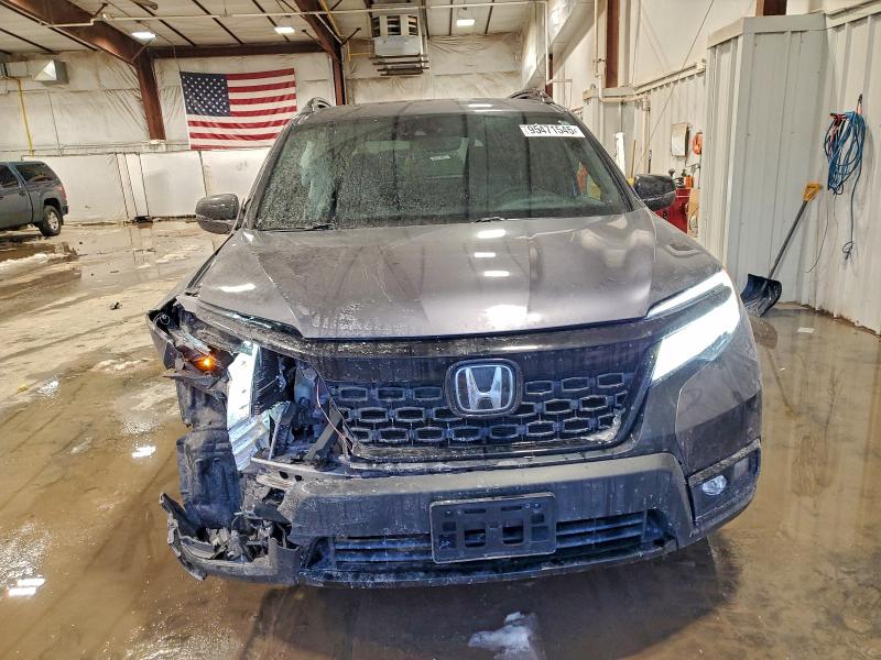 Photo 5 from auction – 2021 HONDA PASSPORT E with VIN 5FNYF8H09MB026690