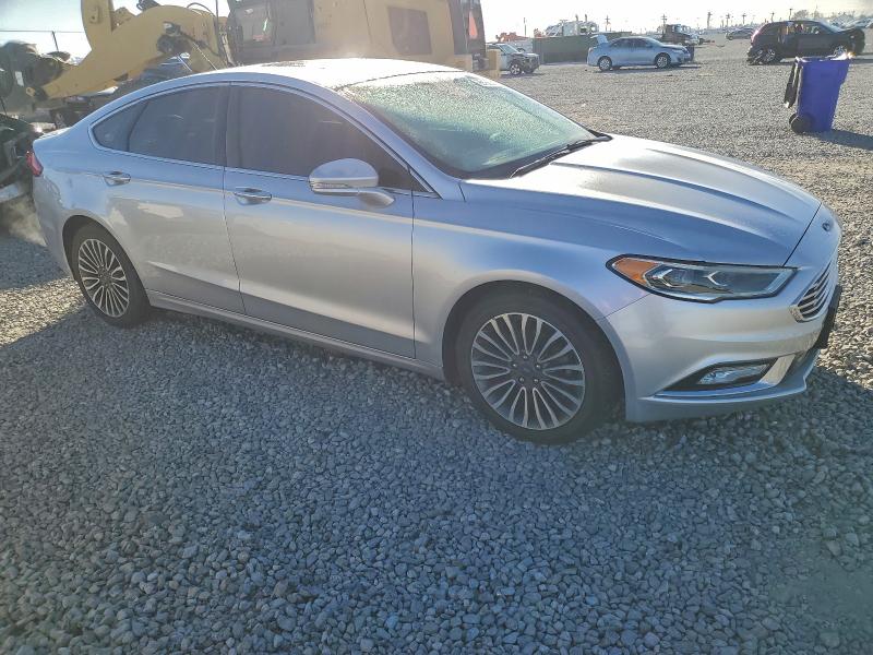 Photo 4 from auction – 2017 FORD FUSION TIT with VIN 3FA6P0D98HR221555