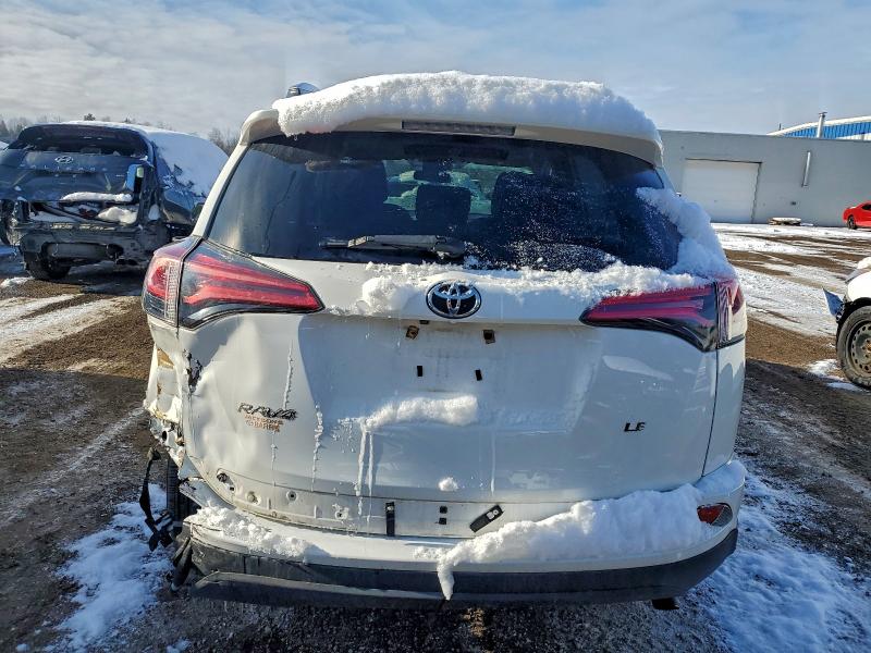 Photo 6 from auction – 2018 TOYOTA RAV4 LE with VIN 2T3ZFREV6JW406599