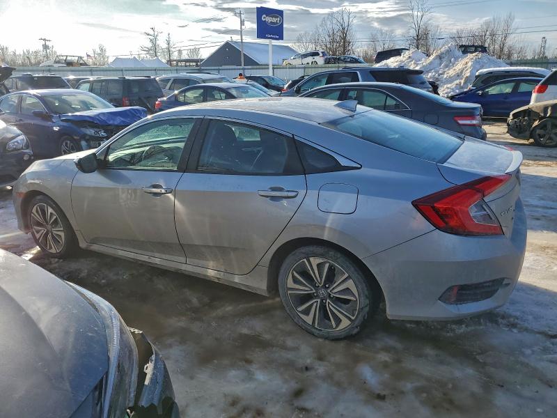 Photo 2 from auction – 2018 HONDA CIVIC EX with VIN 19XFC1F34JE201028
