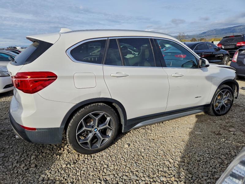 Photo 3 from auction – 2017 BMW X1 XDRIVE2 with VIN WBXHT3C33H5F83279