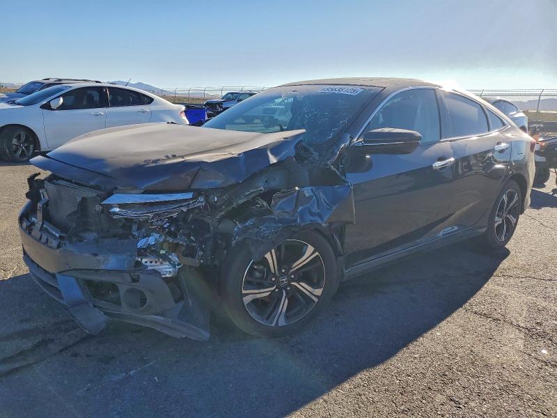HONDA CIVIC TOUR 2017 with VIN 2HGFC1F91HH656388 - Photo from auction