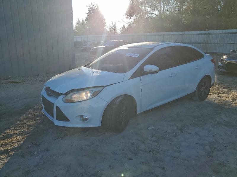FORD FOCUS SE 2014 with VIN 1FADP3F24EL104459 - Photo from auction