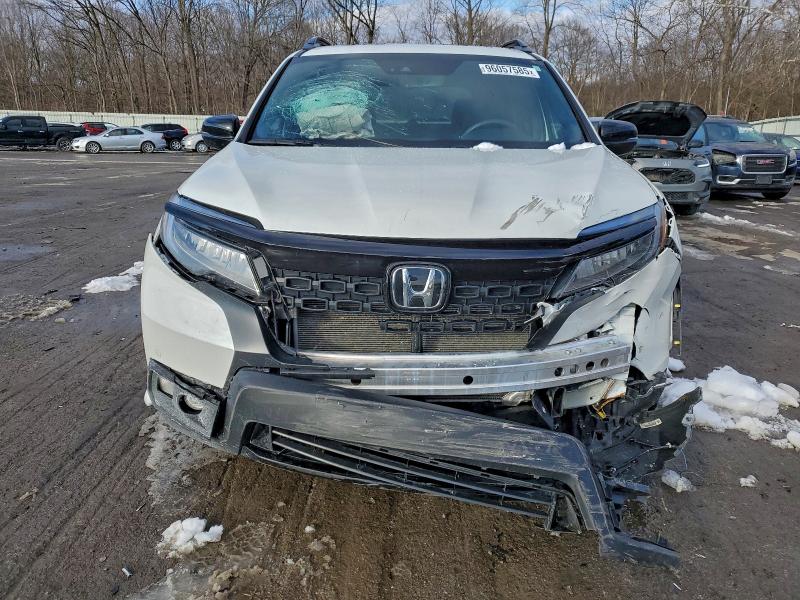 Photo 5 from auction – 2021 HONDA PASSPORT E with VIN 5FNYF8H04MB020389