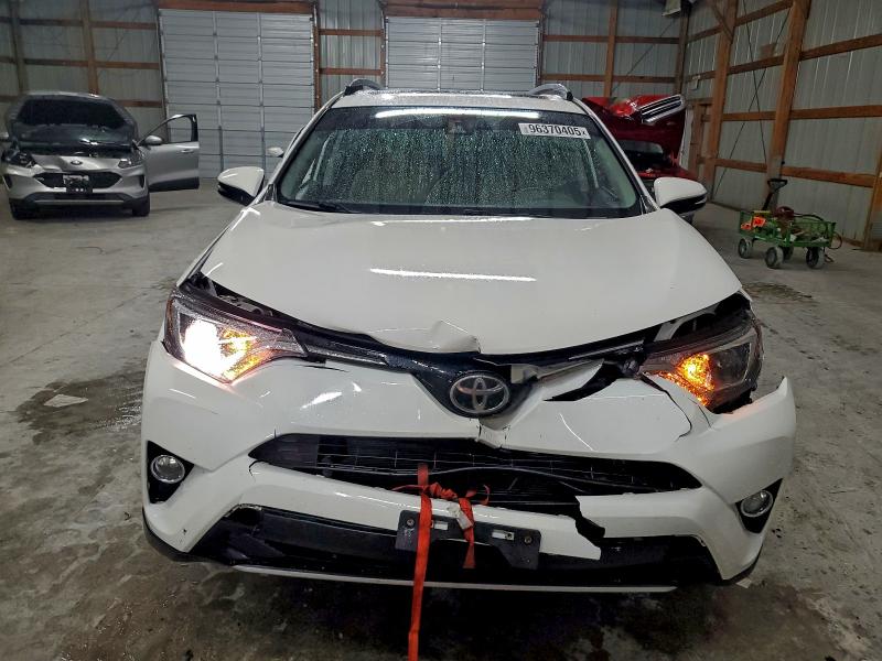 Photo 5 from auction – 2017 TOYOTA RAV4 XLE with VIN JTMWFREV0HJ118329