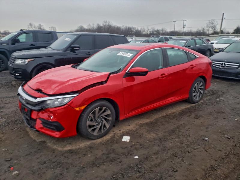HONDA CIVIC EX 2018 with VIN 2HGFC2F7XJH597707 - Photo from auction