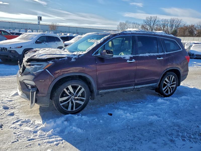 HONDA PILOT TOUR 2016 with VIN 5FNYF6H97GB108487 - Photo from auction