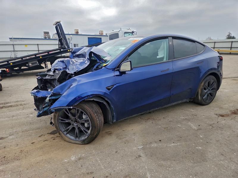 TESLA MODEL Y 2024 with VIN 7SAYGDED4RA334046 - Photo from auction