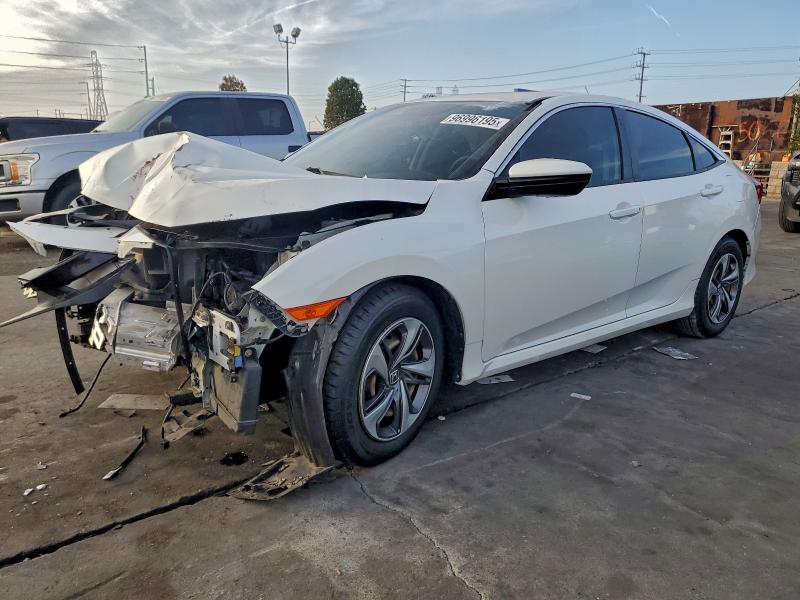 HONDA CIVIC LX 2020 with VIN 19XFC2F69LE201108 - Photo from auction