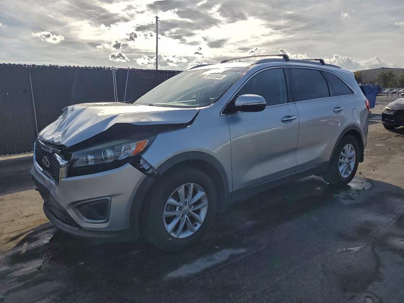 KIA SORENTO LX 2016 with VIN 5XYPG4A37GG036007 - Photo from auction
