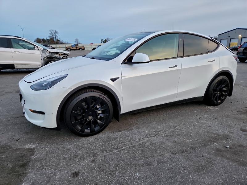 TESLA MODEL Y 2023 with VIN 7SAYGDEE1PA208149 - Photo from auction