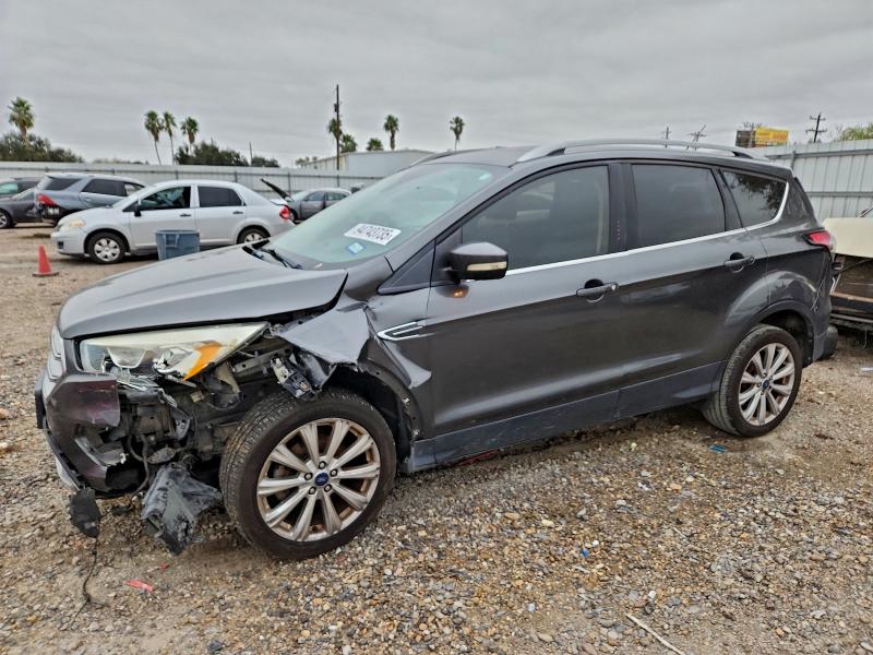 FORD ESCAPE TIT 2017 with VIN 1FMCU0JD1HUC76674 - Photo from auction