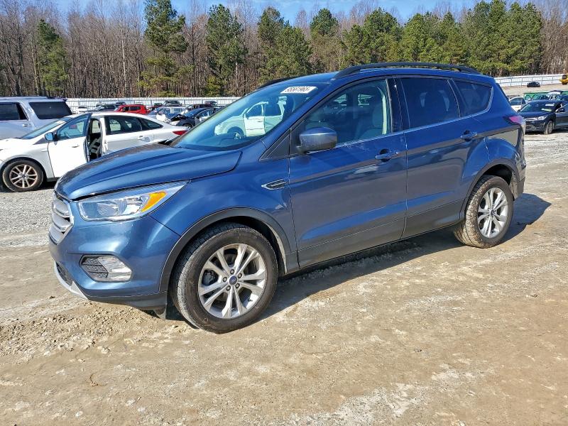 FORD ESCAPE SE 2018 with VIN 1FMCU0GD7JUC63232 - Photo from auction