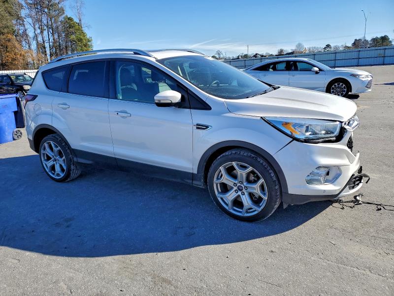 Photo 4 from auction – 2017 FORD ESCAPE TIT with VIN 1FMCU0J99HUC06884
