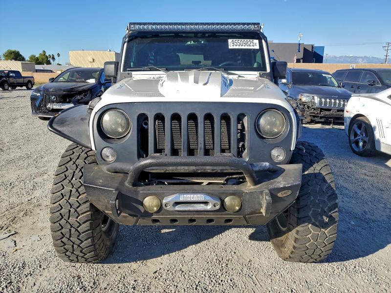 Photo 5 from auction – 2014 JEEP WRANGLER U with VIN 1C4BJWFG7EL141747