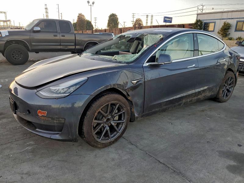 TESLA MODEL 3 2020 with VIN 5YJ3E1EA7LF718009 - Photo from auction