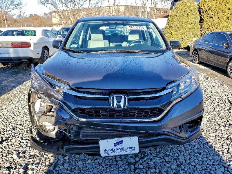 Photo 5 from auction – 2016 HONDA CR-V LX with VIN 5J6RM4H32GL133315