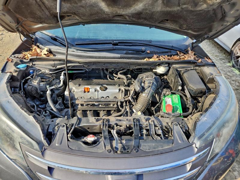 Photo 12 from auction – 2014 HONDA CRV with VIN 5J6RM4H71EL077528