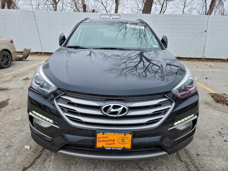 Photo 5 from auction – 2017 HYUNDAI SANTA FE S with VIN 5NMZU3LB8HH052126
