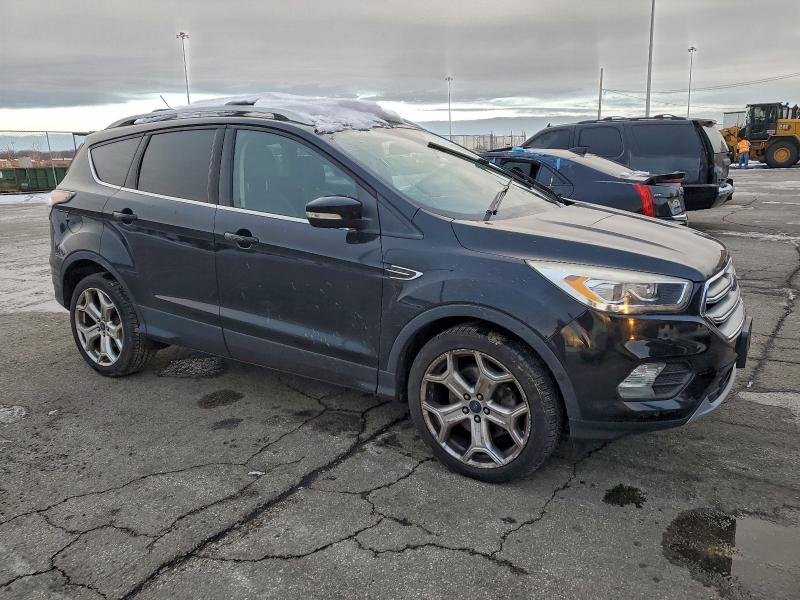 Photo 4 from auction – 2017 FORD ESCAPE TIT with VIN 1FMCU9J96HUB14006