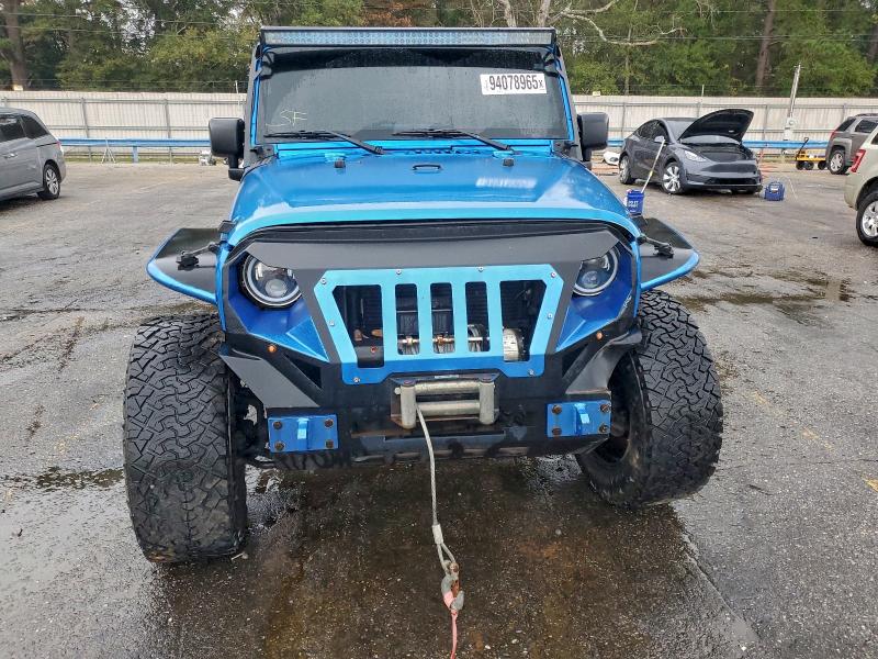 Photo 5 from auction – 2016 JEEP WRANGLER U with VIN 1C4BJWDG5GL131398
