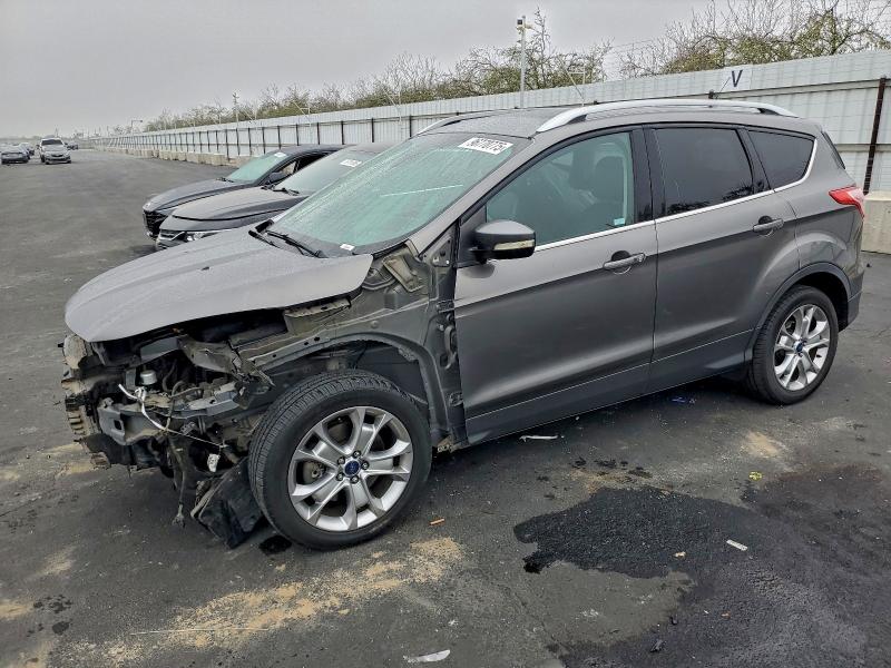 FORD ESCAPE TIT 2014 with VIN 1FMCU0J98EUB47919 - Photo from auction