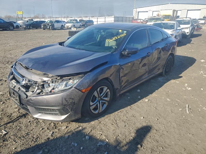 HONDA CIVIC LX 2018 with VIN 19XFC2F50JE036098 - Photo from auction