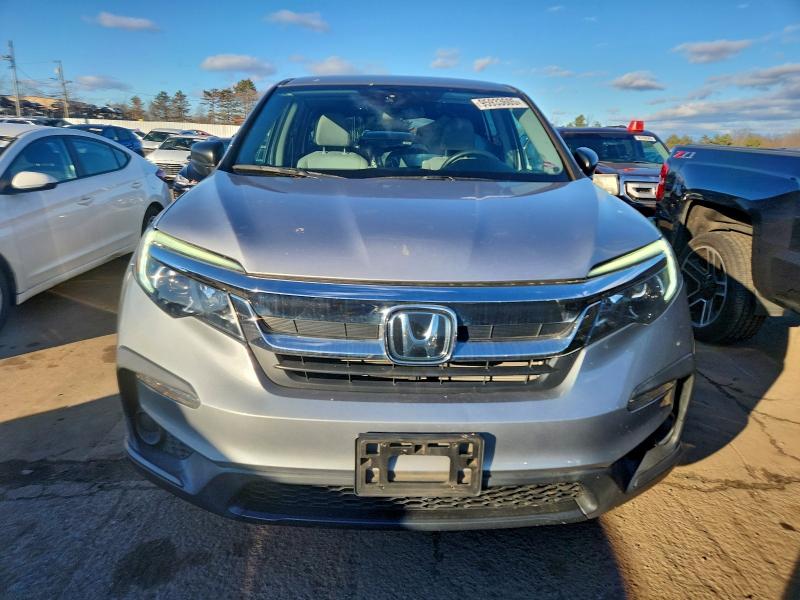 Photo 5 from auction – 2021 HONDA PILOT LX with VIN 5FNYF6H10MB018054