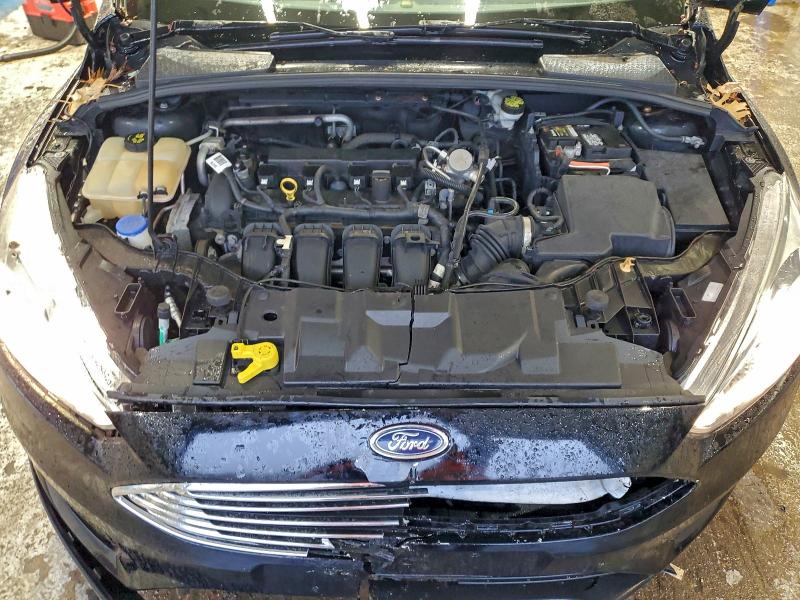 Photo 11 from auction – 2016 FORD FOCUS with VIN 1FADP3F28GL396619