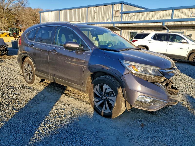 Photo 4 from auction – 2015 HONDA CR-V TOURI with VIN 5J6RM4H98FL069641