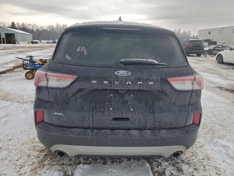 Photo 6 from auction – 2021 FORD ESCAPE SEL with VIN 1FMCU0H65MUA20409