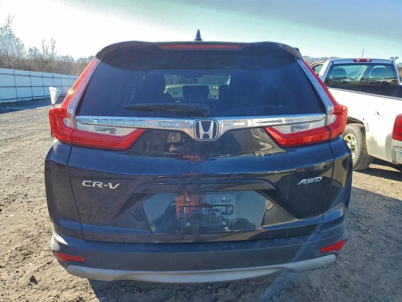 Photo 6 from auction – 2018 HONDA CR-V with VIN 7FARW2H53JE071119