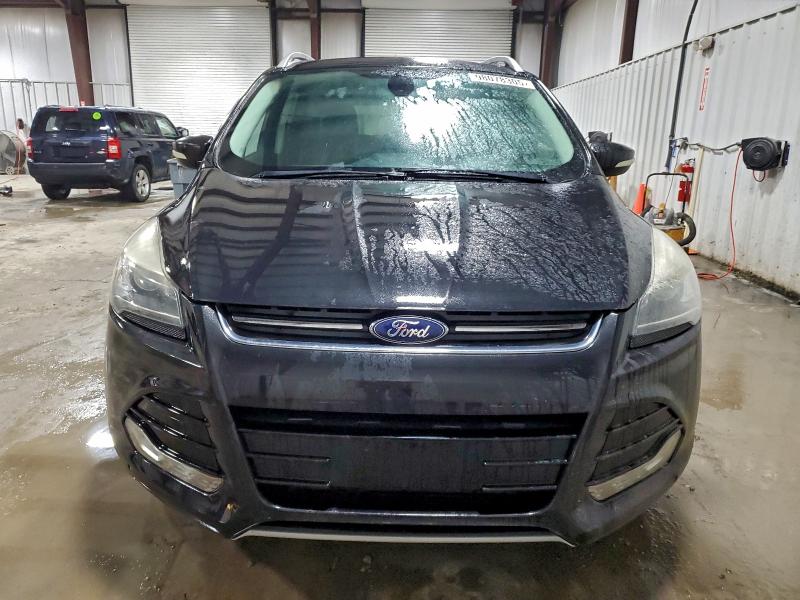 Foto 5 de la subasta – 2015 FORD ESCAPE TIT con VIN 1FMCU9J98FUC68052