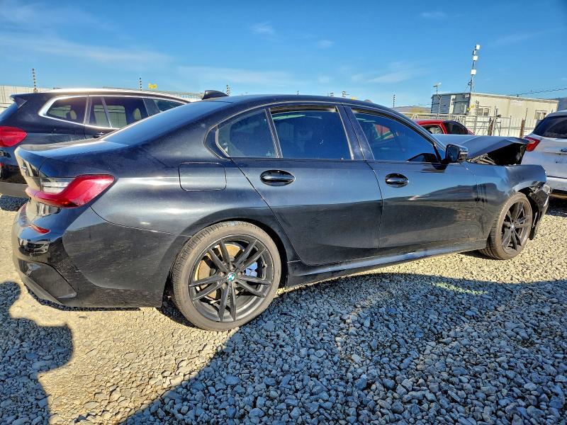 Photo 3 from auction – 2021 BMW 330I with VIN 3MW5R1J06M8B97975