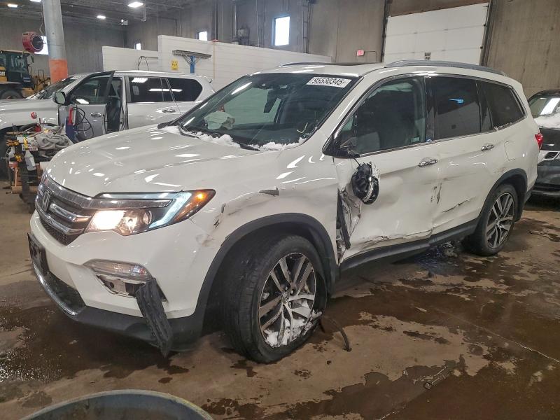 HONDA PILOT TOUR 2018 with VIN 5FNYF6H90JB051802 - Photo from auction