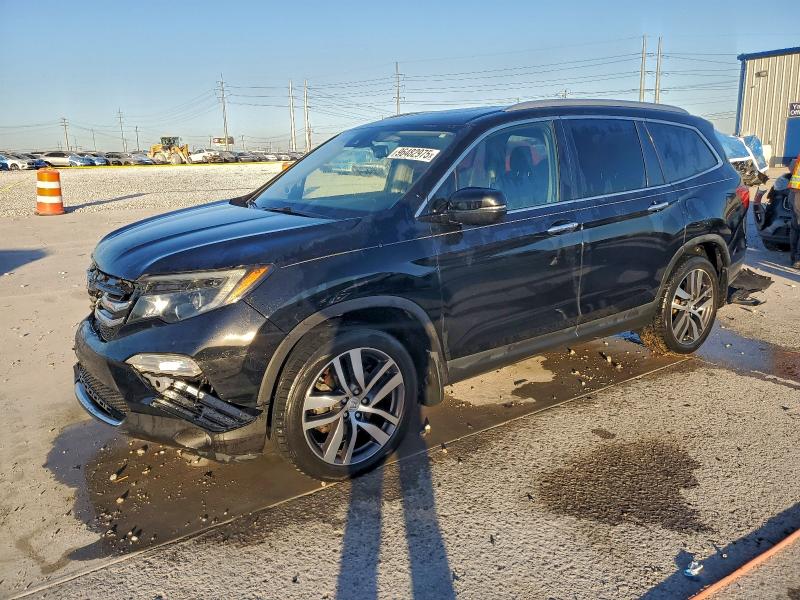 HONDA PILOT TOUR 2017 with VIN 5FNYF5H97HB046701 - Photo from auction