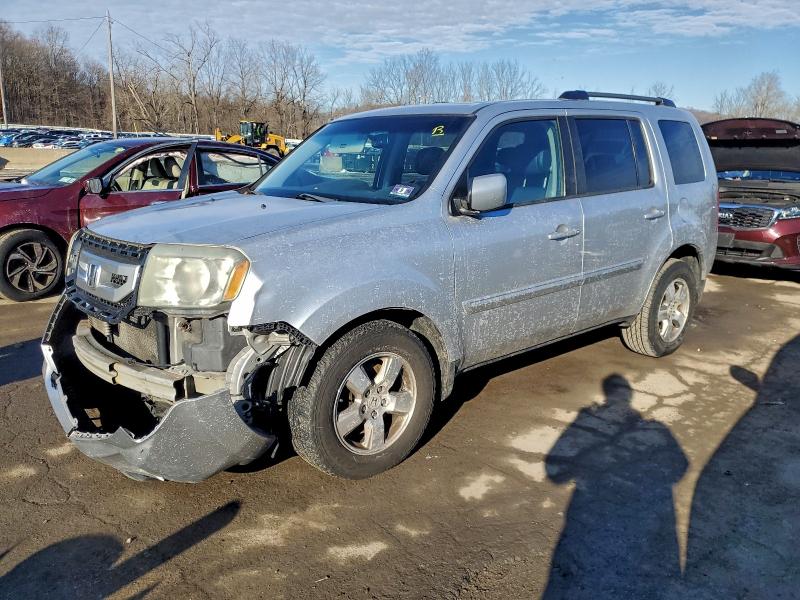 HONDA PILOT EXLN 2011 with VIN 5FNYF4H71BB097546 - Photo from auction