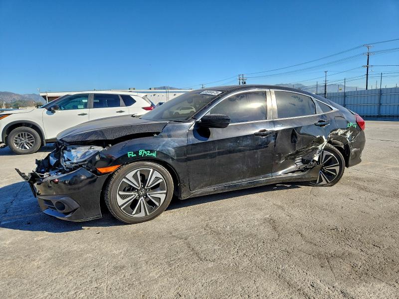 HONDA CIVIC EXL 2018 with VIN JHMFC1F71JX009535 - Photo from auction