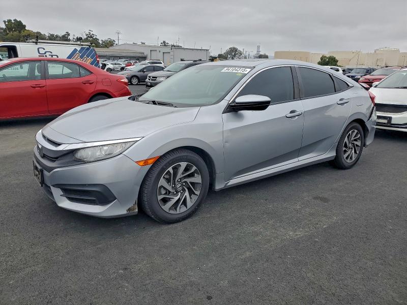 HONDA CIVIC EX 2018 with VIN 19XFC2F76JE202951 - Photo from auction