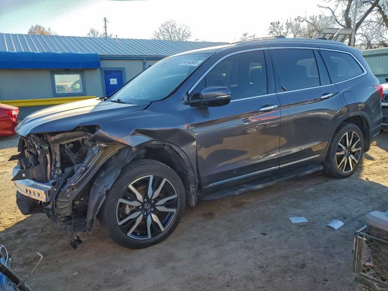 HONDA PILOT TOUR 2021 with VIN 5FNYF6H90MB052260 - Photo from auction