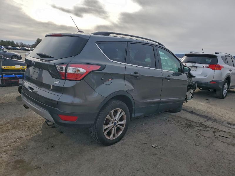 Photo 3 from auction – 2017 FORD ESCAPE with VIN 1FMCU9GD6HUC83342