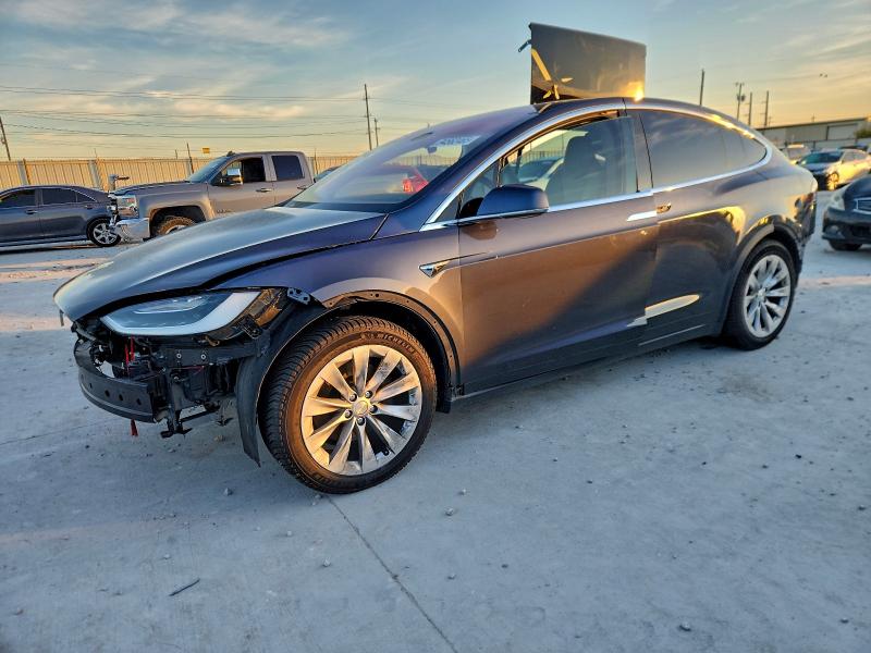 TESLA MODEL X 2018 with VIN 5YJXCDE23JF128582 - Photo from auction