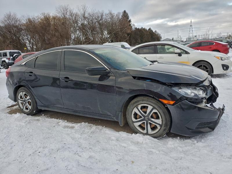 Photo 4 from auction – 2017 HONDA CIVIC LX with VIN 2HGFC2F53HH035141