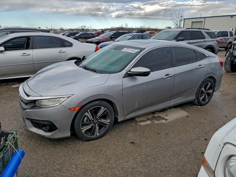 HONDA CIVIC TOUR 2016 with VIN 19XFC1F99GE038647 - Photo from auction